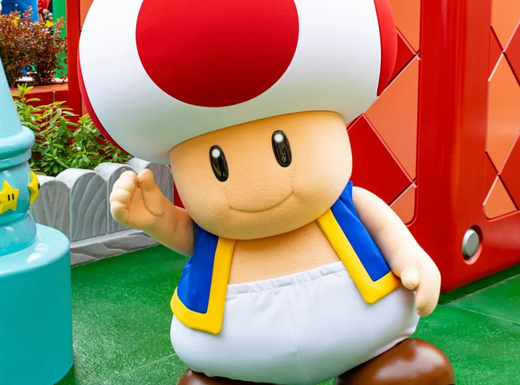 Pemandangan di dalam SUPER NINTENDO WORLD yang penuh warna dengan balok-balok ikonik.