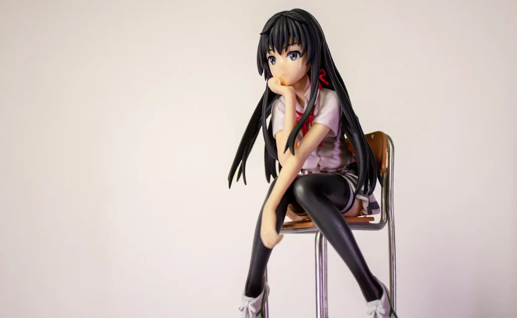 Seseorang sedang membaca manga di ruangan yang nyaman.